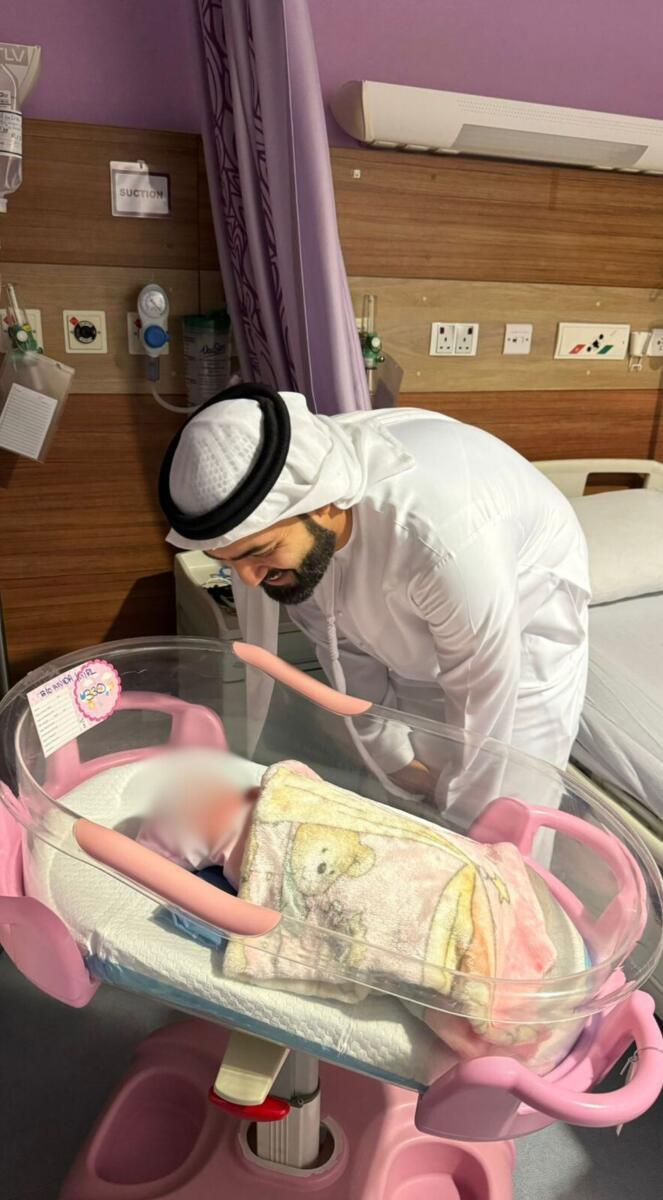 Ahmad with the baby