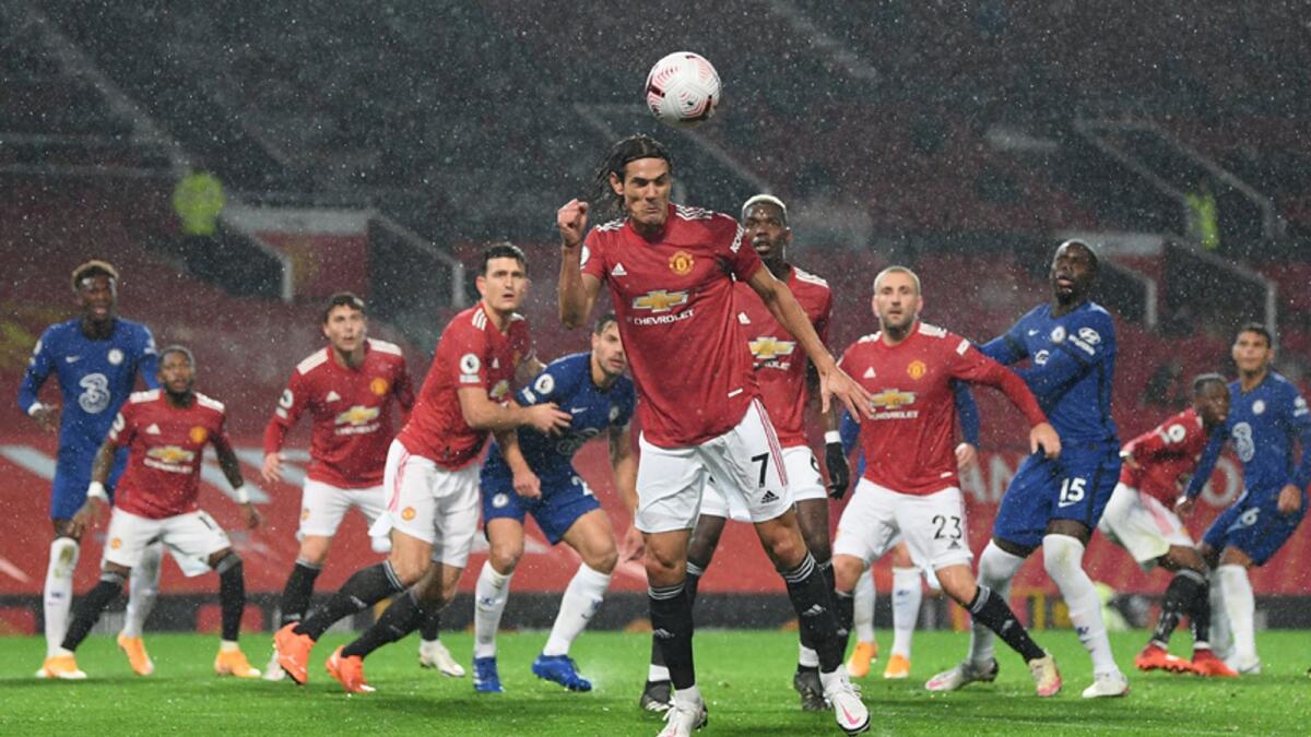 Manchester United's Edinson Cavani heads the ball during the English Premier League match against Chelsea on Saturday. — Reuters