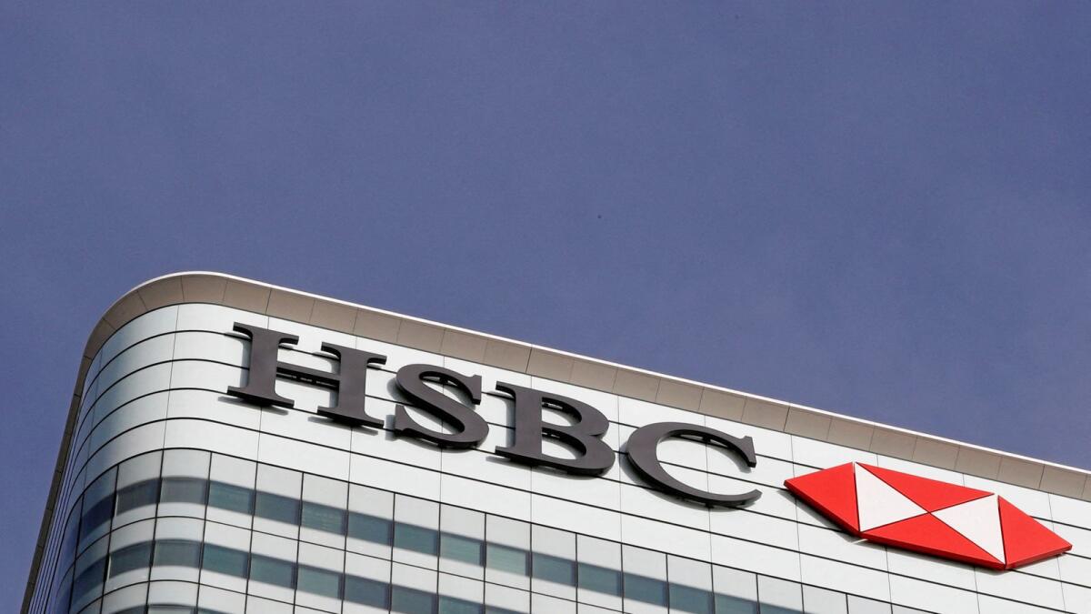 The HSBC bank logo is seen in the Canary Wharf financial district in London. — Reuters