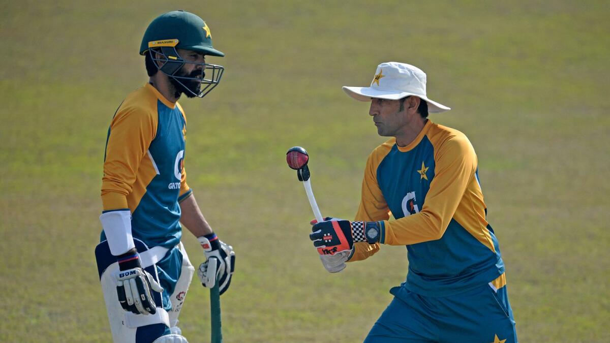 Pakistan batting coach Younis Khan with Fawad Alam during a practice session at the Rawalpindi Stadium on February 1, 2021. (AFP file)