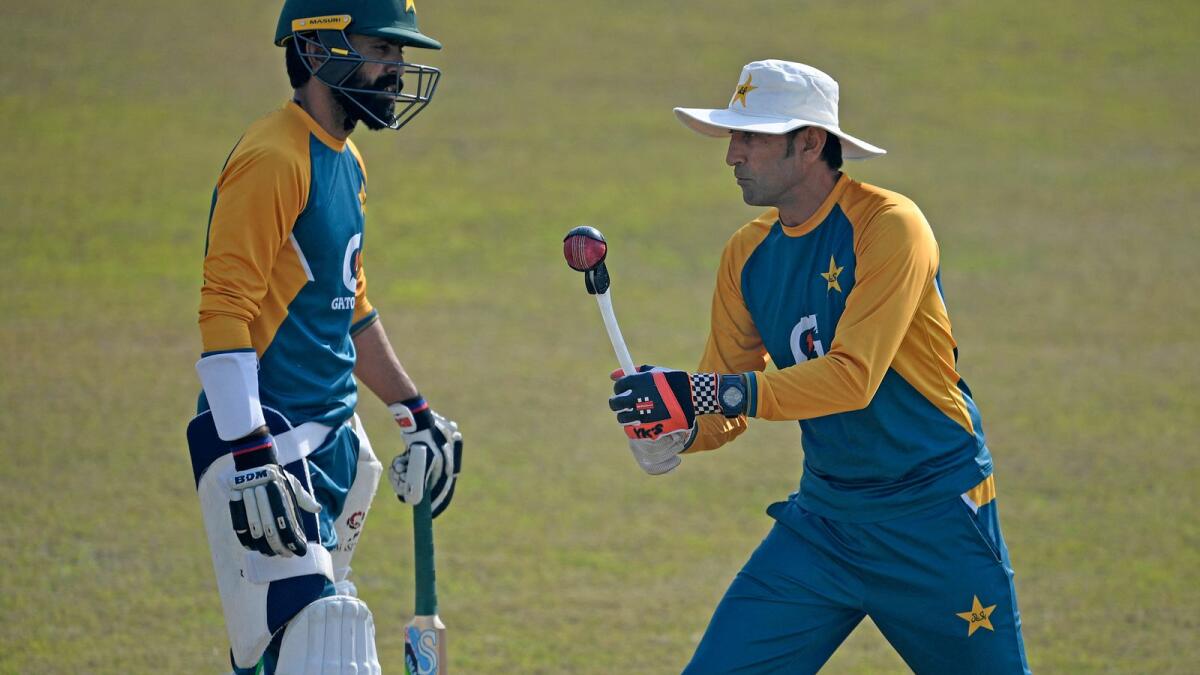 Pakistan batting coach Younis Khan with Fawad Alam during a practice session at the Rawalpindi Stadium on February 1, 2021. (AFP file)