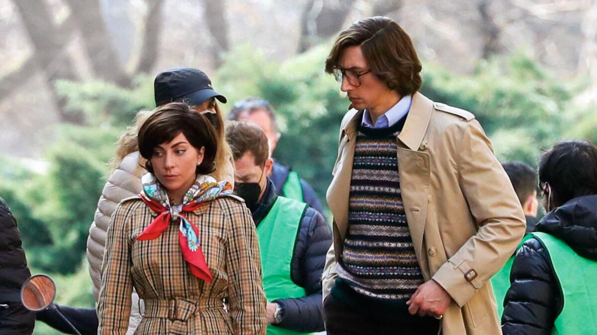 Lady Gaga as Patrizia Reggiani and Adam Driver as Maurizio Gucci in House of Gucci, the film based on Forden’s book