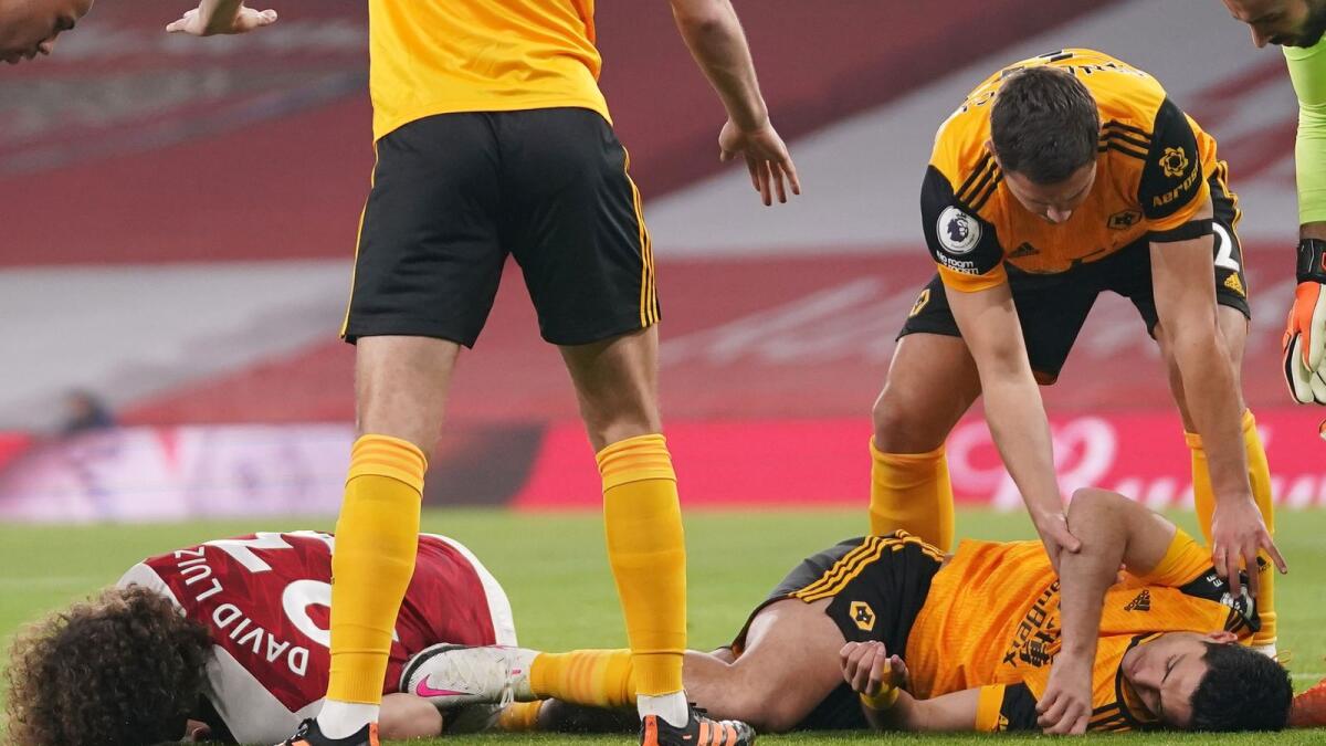 Arsenal's David Luiz and Wolverhampton Wanderers' Raul Jimenez after a head-on collision. (Reuters)