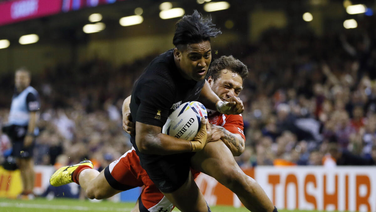New Zealand’s Julian Savea goes on to score a try during the Rugby World Cup Pool C match against Georgia. 