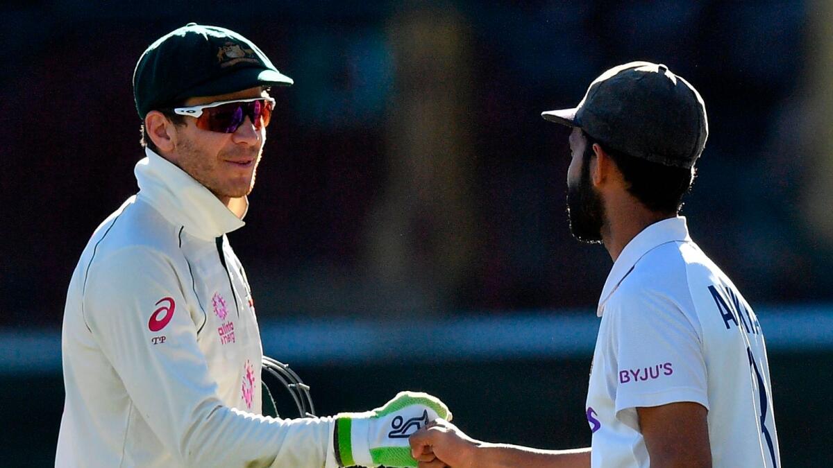 Australia's captain Tim Paine (left) and India's captain Ajinkya Rahane greet each other at the end of the third cricket Test. — AFP