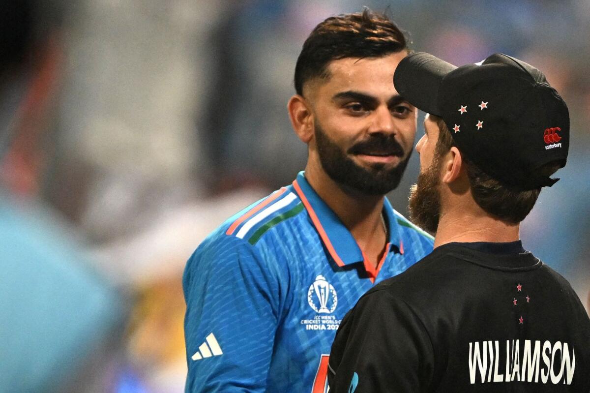 Virat Kohli and New Zealand captain Kane Williamson greet each other at the end of the semifinal match. — AFP