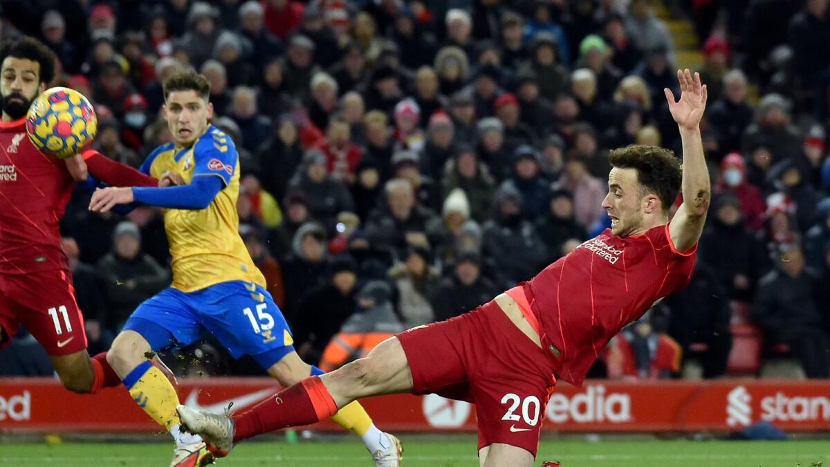Liverpool's Diogo Jota (right) attempts a shot at goal against Southampton. (AP)