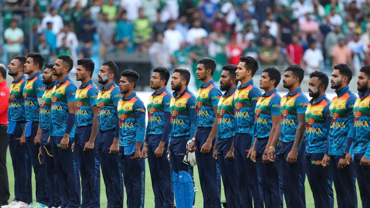 Sri Lanka's players sing their national anthem. — AFP