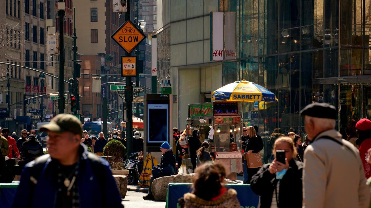 Pedestrians in Herald Square in New York. Despite hopeful signs, like more people working and signs that inflation is dissipating, economists worry that a recession is on the way or that the Fed will cause one in trying to rein in inflation. (Gabby Jones/The New York Times)