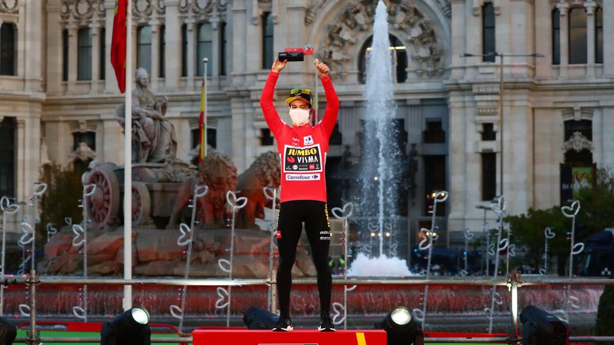 Jumbo-Visma's Primoz Roglic celebrates on the podium after winning Vuelta a Espana.— Reuters