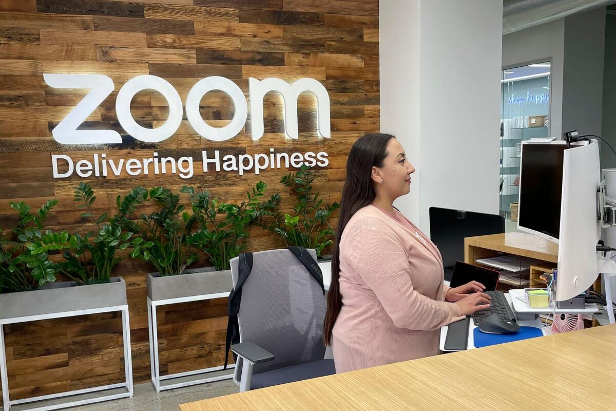 A woman works at Zoom headquarters on February 3, 2023 in San Jose, California. — AP