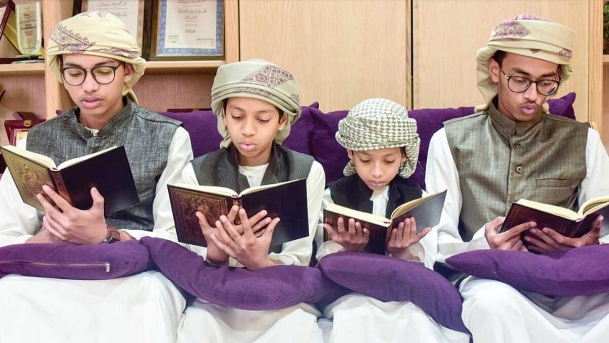 Muhammed Salman Alfarisi, Thauban Khalid, Muhammed Fathih and Muhammed Salah Aldin Ayoubi read from the Holy Quran at the UAE Open Holy Quran Recitation Competition.