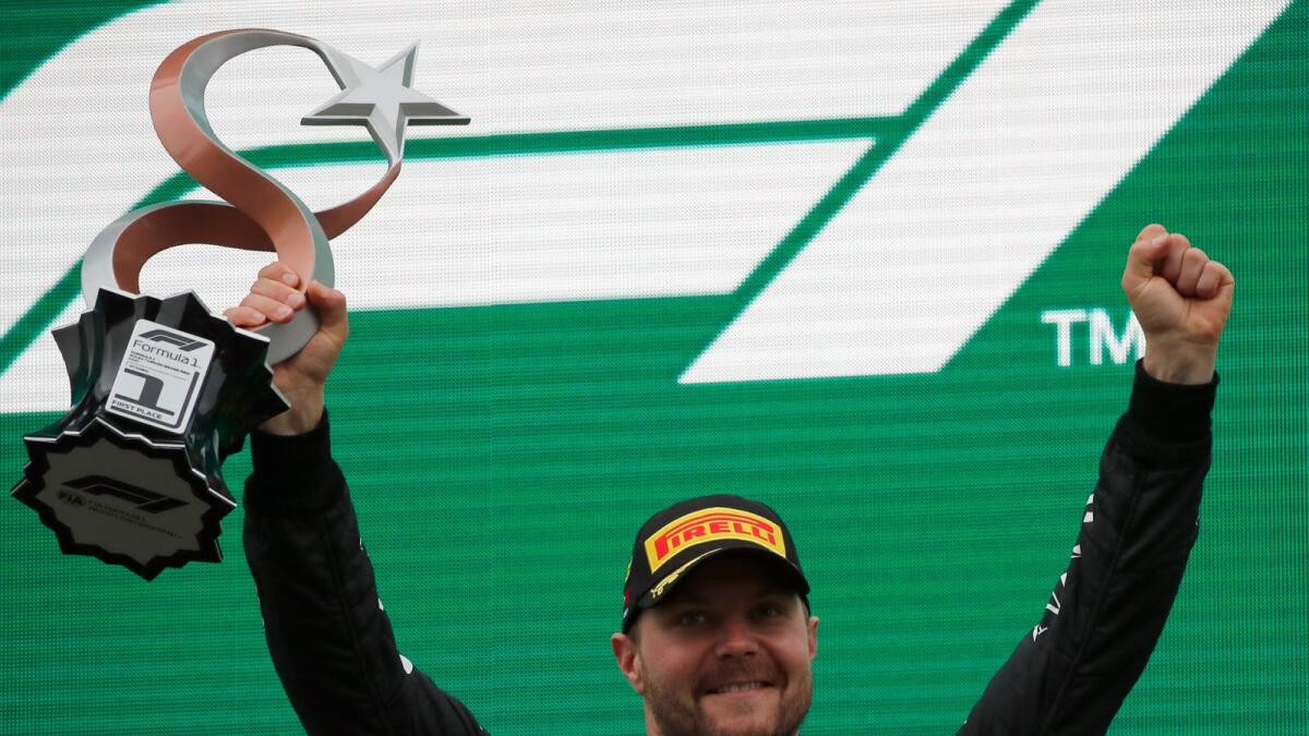 Mercedes driver Valtteri Bottas of Finland celebrates after winning the Turkish Formula One Grand Prix. (AP)