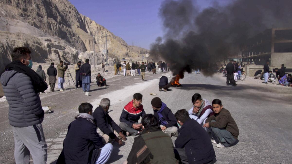 A file photo shows protesters burning tyres against killing of coal mine workers by unknown gunmen near the Machh coal field, in Quetta in January this year. — AP file
