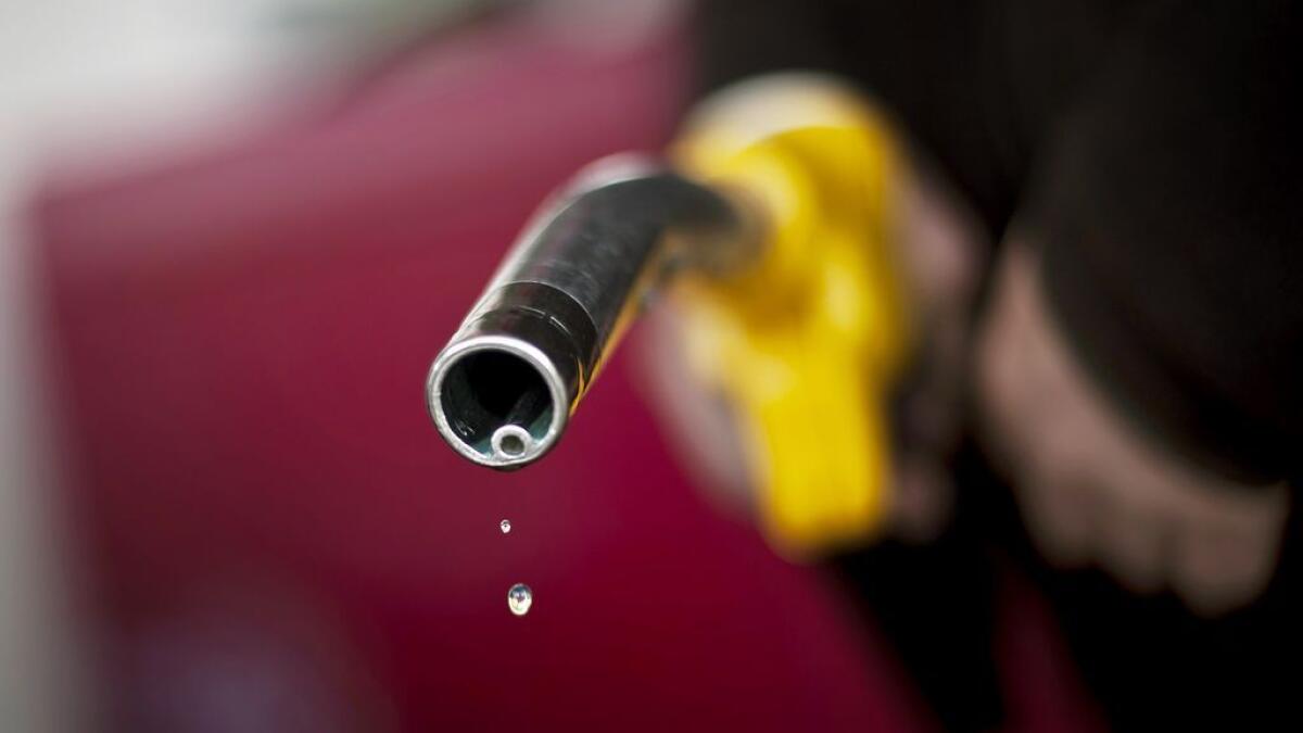 This file picture shows a driver after refueling at a Dijons gas station.