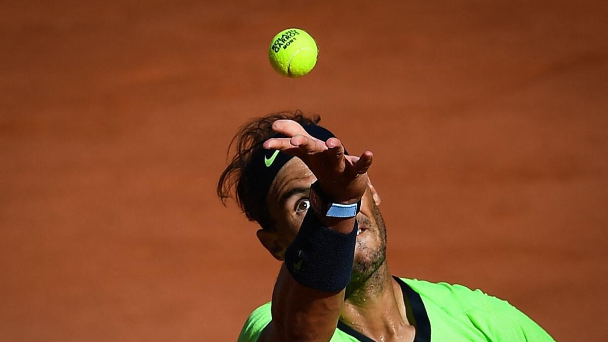 Spain's Rafael Nadal serves during the match against Australia's Alexei Popyrin. (AFP)