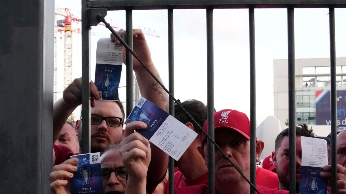 Fans shows tickets in front of the Stade de France prior the Champions League final  between Liverpool and Real Madrid. — AP