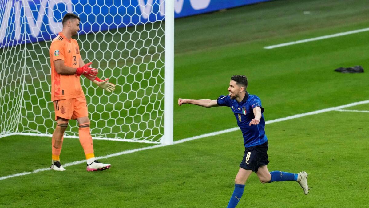 Italy's midfielder Jorginho celebrates after scoring the winning goal in a penalty shootout during the Euro 2020 semifinal against Spain. — AFP