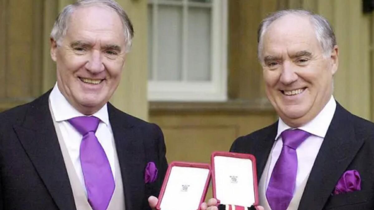 Sir David Barclay, left, with his twin brother Sir Frederick. AFP