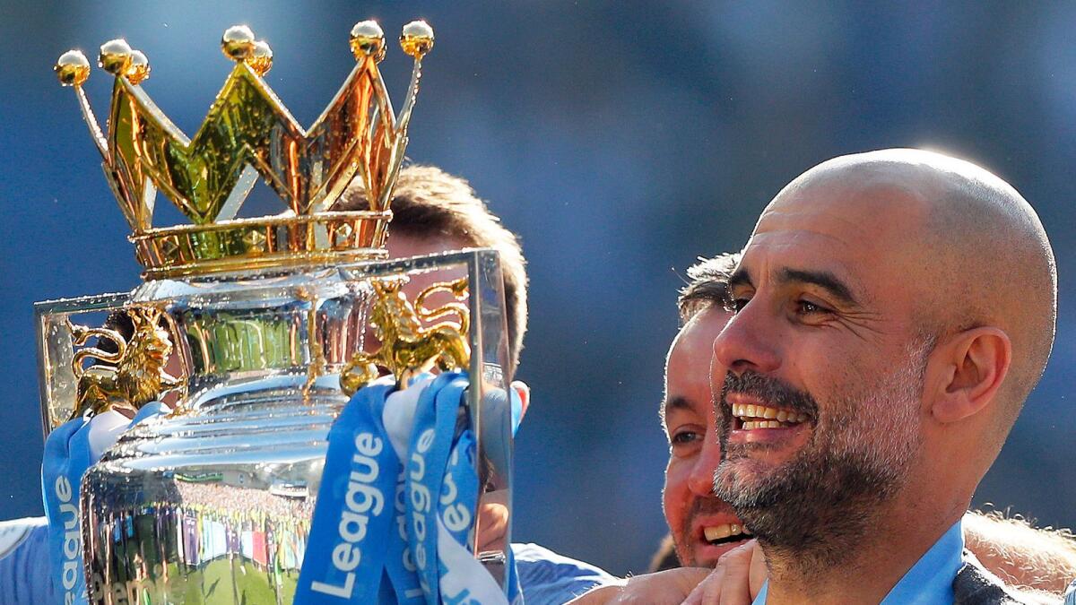 Pep Guardiola has won two Premier League titles, three League Cups and the FA Cup with City. (AP)