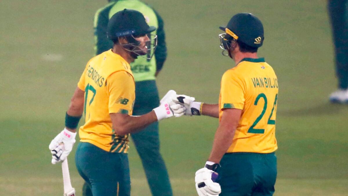 South Africa's Pite van Biljon (right) celebrates with teammate Reeza Hendricks after hitting a boundary during the second Twenty20 match on Saturday. — AP