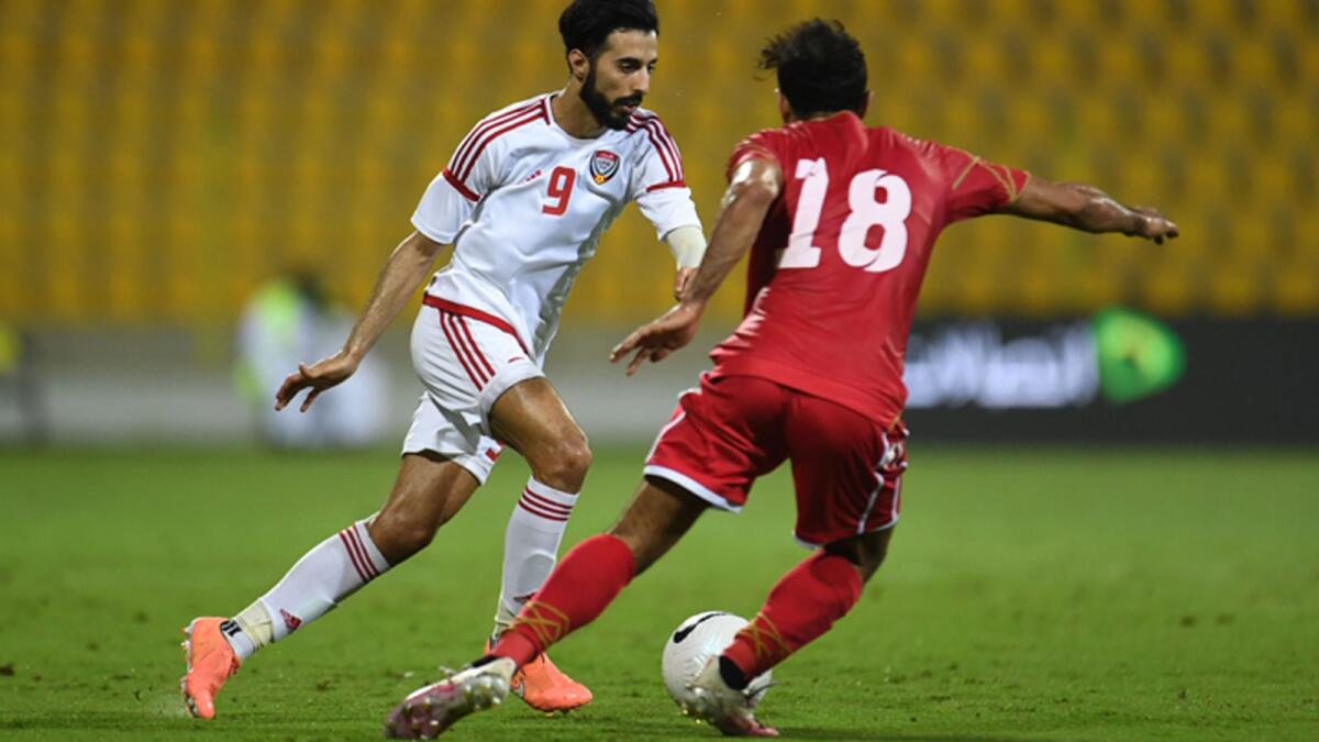 The UAE’s Bandar Al Ahbabi (left) vies for the ball with a Bahrain player during their friendly match on Monday. — Supplied photo