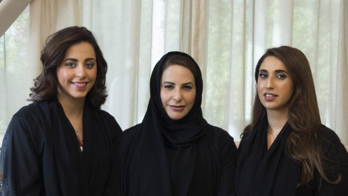 Huda Al Ali (centre) with her daughters. Photo: Supplied