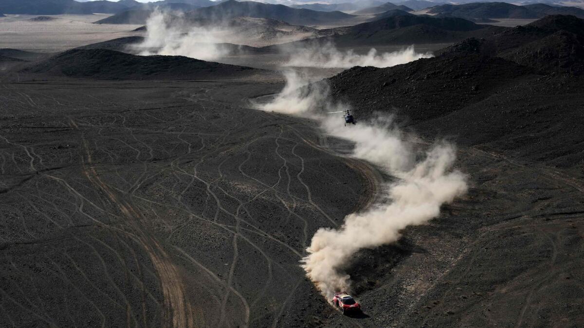 French driver Sebastien Loeb and co-driver Fabian Lurquin of Belgium compete during Stage 7 of the Dakar Rally on Sunday. (AFP)