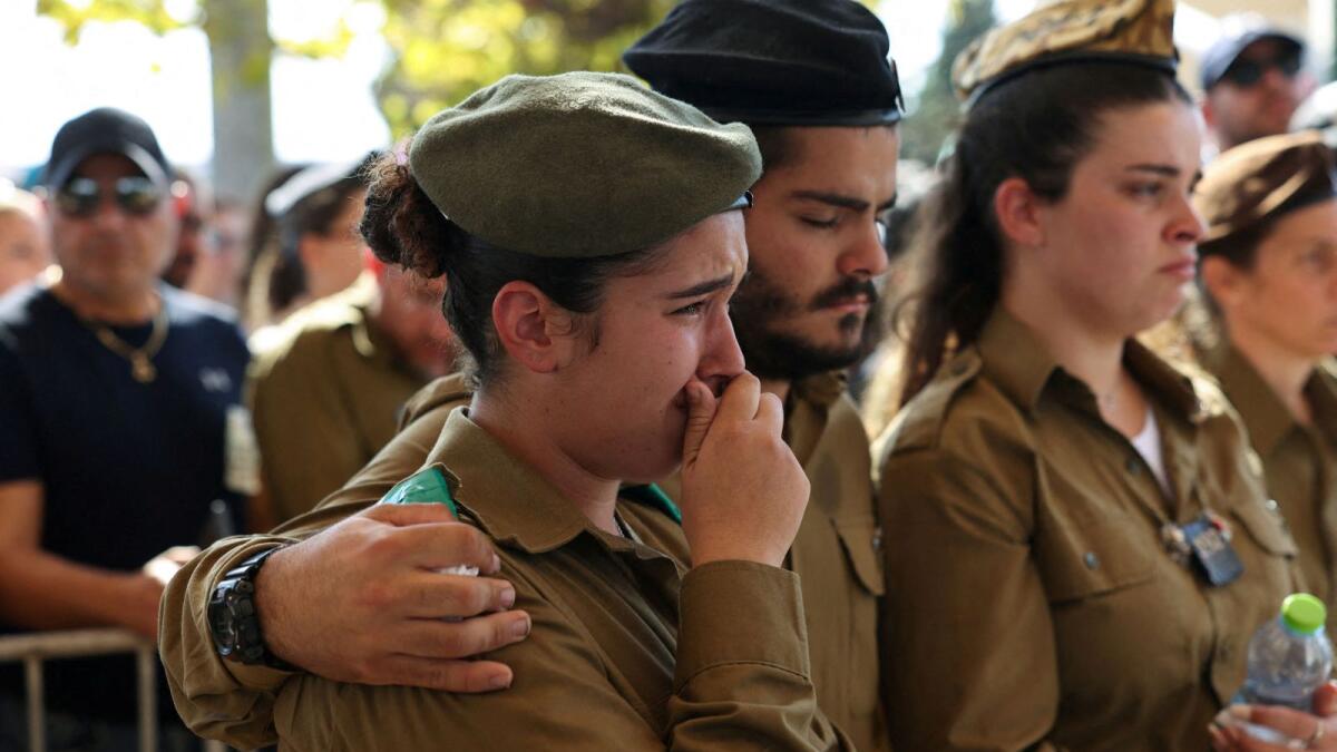 Friends and family mourn during Israeli soldier Corporal Noa Marciano's funeral after her remains were recovered near Al Shifa Hospital. — Reuters