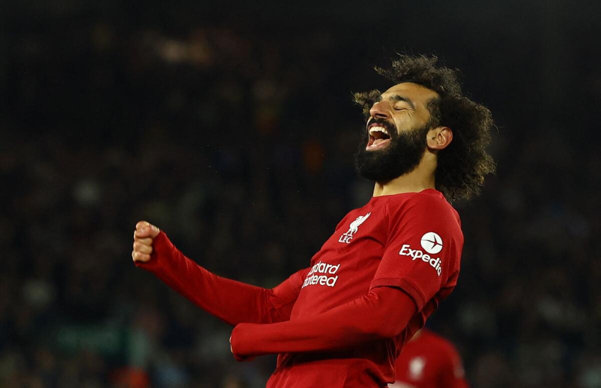 Liverpool's Mohamed Salah celebrates scoring their fourth goal. — Reuters