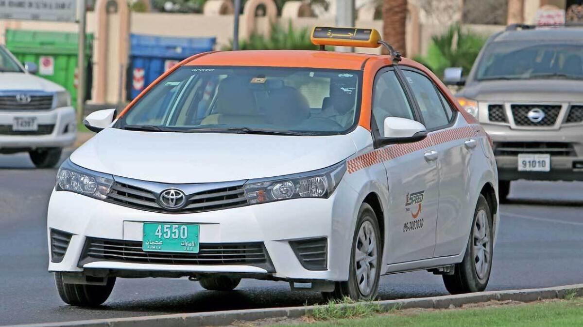 One of the new taxis hits the road in Ajman. — Photo by M. Sajjad 