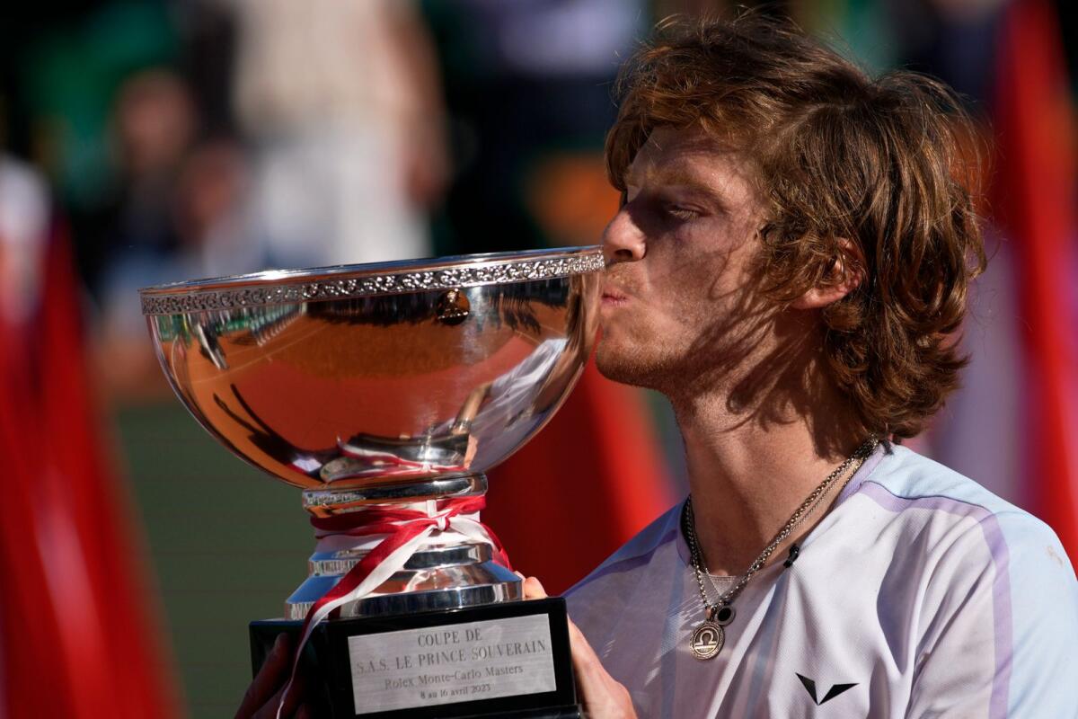 Andrey Rublev of Russia kisses the trophy after defeating Holger Rune of Denmark in the Monte Carlo Masters final. — AP