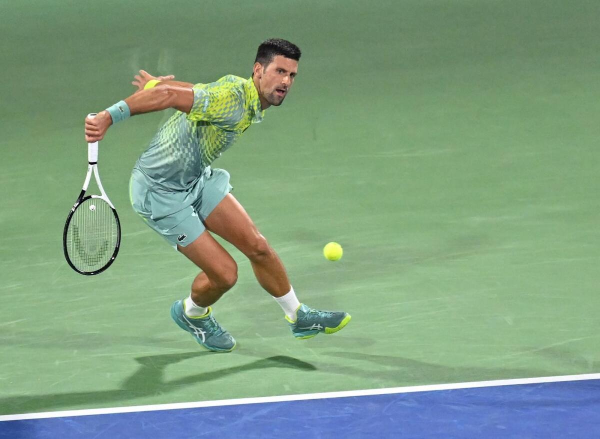 Novak Djokovic hits a backhand return during his quarterfinal match in Dubai on Thursday. M Sajjad/Khaleej Times