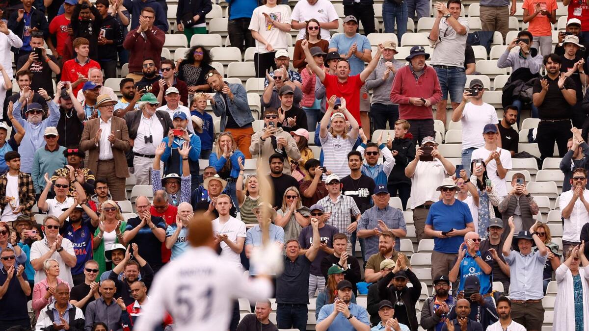 Fans applaud England's Jonny Bairstow after he completes his century on the fifth day of the fifth Test at Edgbaston on Tuesday. — Reuters
