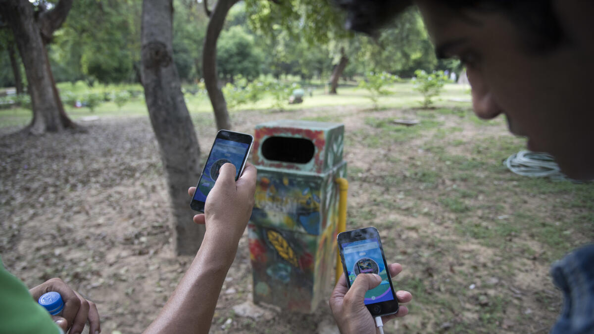 In this Monday, July 22, 2016. photo, random 'pokestops' are deployed in the game Pokemon Go for players to gather Pokeballs and goodies, in Lodhi garden, New Delhi, India. 'Pokemon Go,' the highly addictive online game, has landed in India and thousands are out searching for pokemon characters as the mania spreads. Although it has not been launched officially in India, the augmented-reality-based game has caught on, with fans also using virtual private networks (VPNs) to change their locations and catch pokemons in New York and London while sitting in their Indian homes. (AP Photo/Thomas Cytrynowicz)
