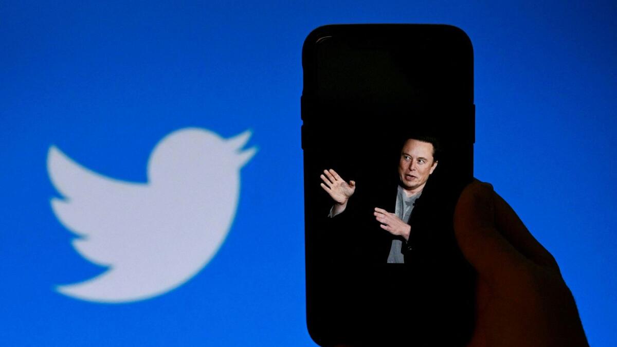 An illustration photo shows a phone screen displaying a photo of Elon Musk with the Twitter logo shown in the background, in Washington, DC. — AFP file