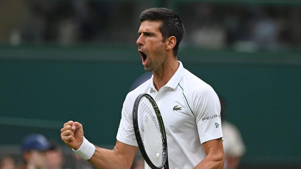 Serbia's Novak Djokovic celebrates going 2-1 up in the fourth set against Britain's Jack Draper during their men's singles first round match on the first day of the 2021 Wimbledon Championships. — AFP