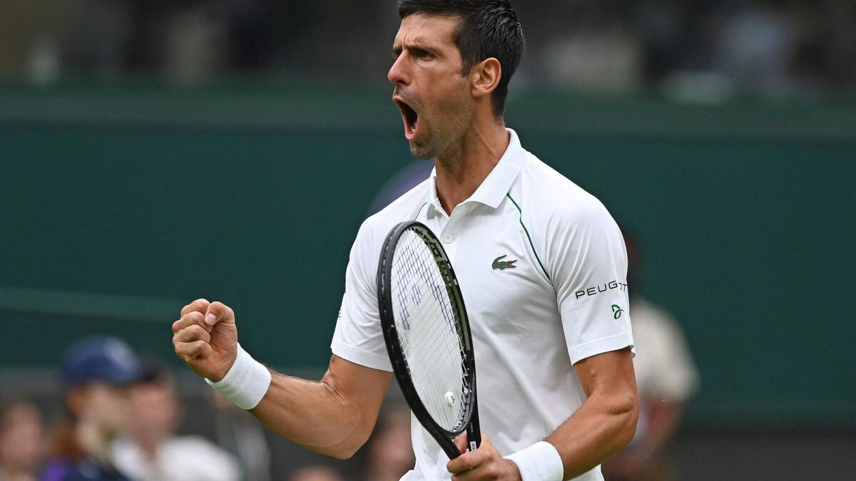 Serbia's Novak Djokovic celebrates going 2-1 up in the fourth set against Britain's Jack Draper during their men's singles first round match on the first day of the 2021 Wimbledon Championships. — AFP