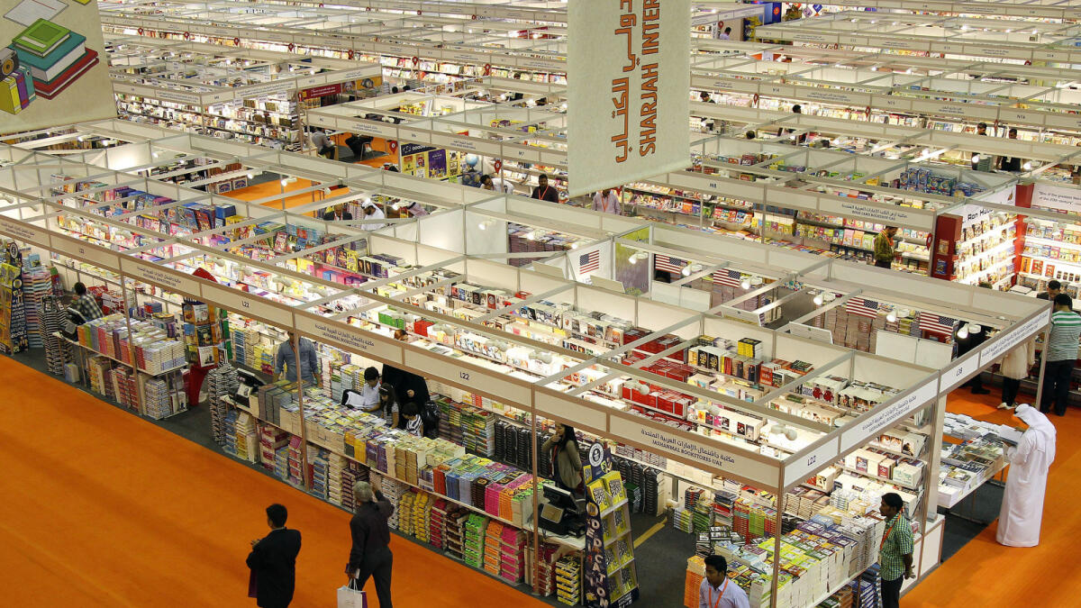Visitors are busy discovering new Books in book stalls at Shajrah international Book fair 2015.