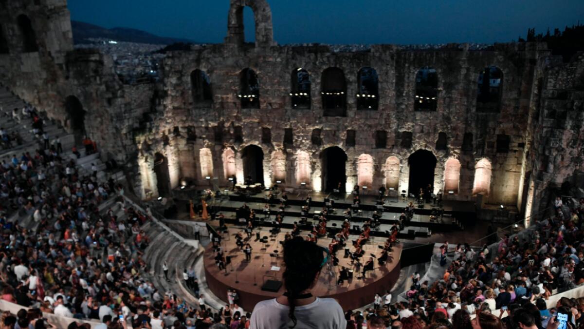 Greek National Opera performs at the Herodus Atticus ancient theatre at the foot of the Acropolis, during a concert featuring a compilation of famous operas in Athens. Photo: AFP