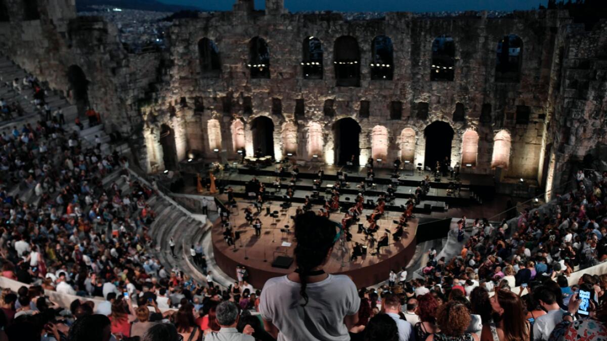 Greek National Opera performs at the Herodus Atticus ancient theatre at the foot of the Acropolis, during a concert featuring a compilation of famous operas in Athens. Photo: AFP