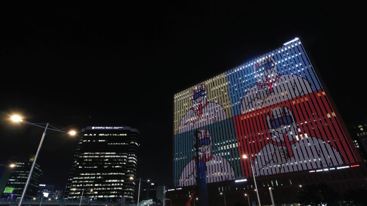 A message of gratitude and support for health workers, frontline workers and the country battling the new coronavirus is displayed on a building in Seoul, South Korea. Photo: AP