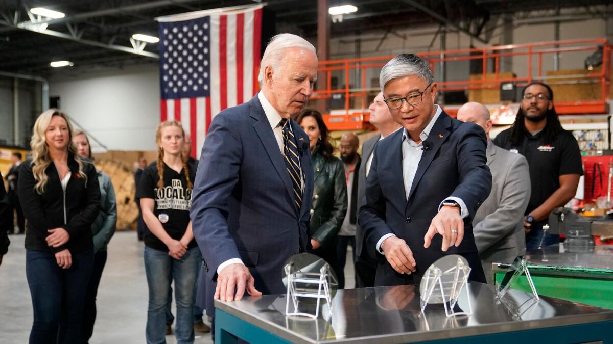 President Joe Biden tours SK Siltron CSS, a computer chip factory in Bay City, Michigan, in November last yaer, with SK Siltron CSS CEO Jianwei Dong. - AP
