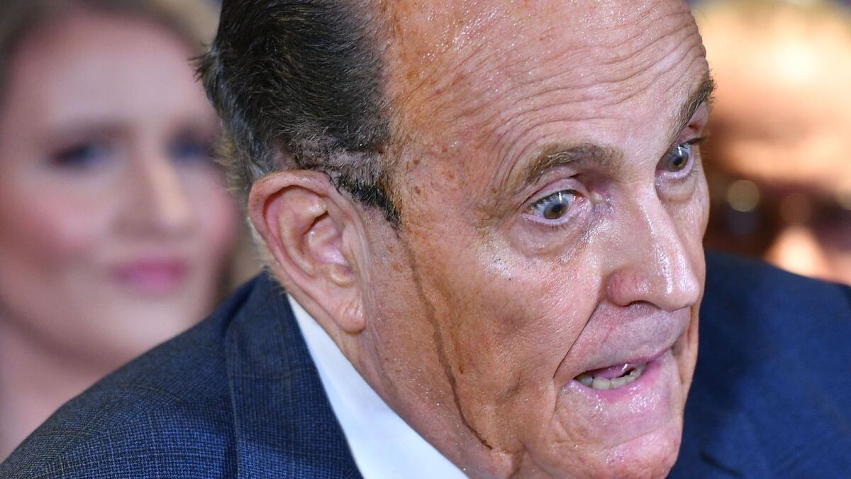 Trump's personal lawyer Rudy Giuliani perspires as he speaks during a press conference at the Republican National Committee headquarters in Washington.