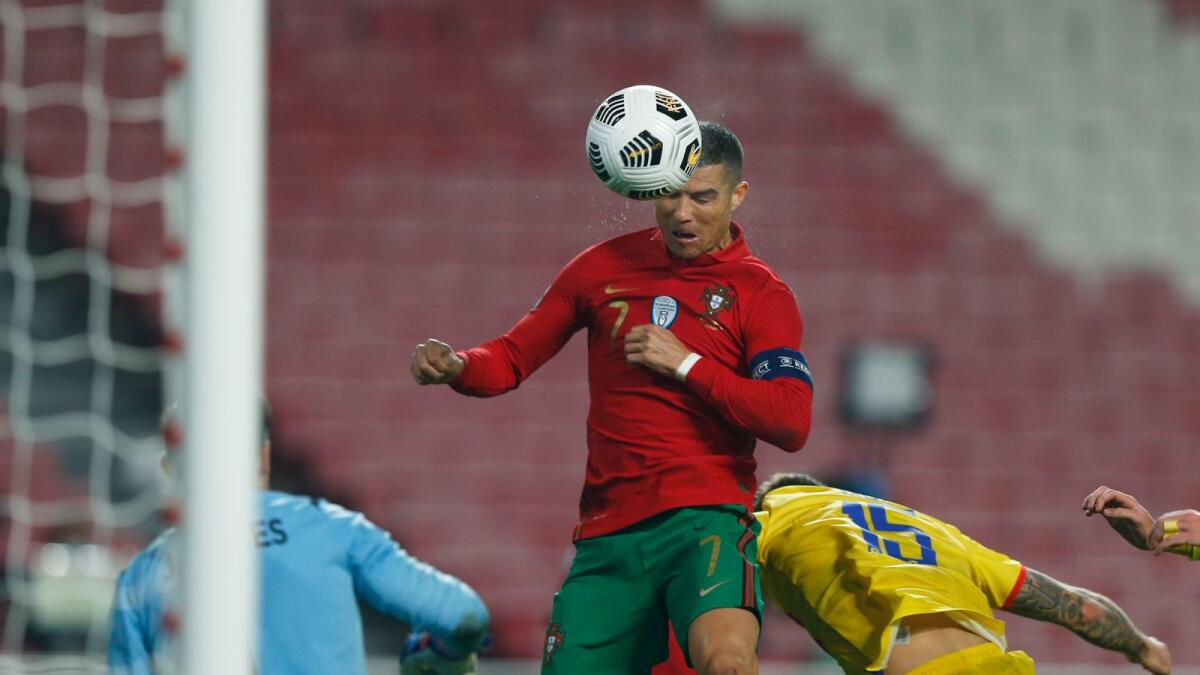 Portugal's Cristiano Ronaldo scores their sixth goal in their 7-0 rout of Andorra.