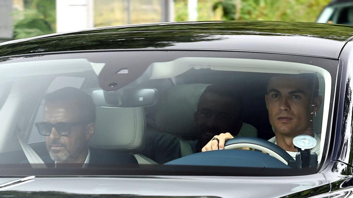 Manchester United's Cristiano Ronaldo arrives at Carrington Training Ground on Tuesday. — AP