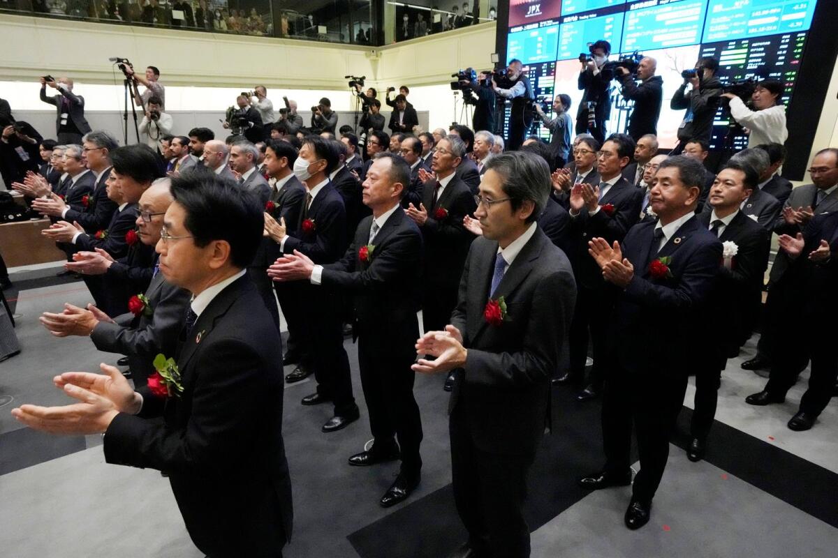 Staff of the Tokyo Stock Exchange and guests make a ceremonial hand-clapping during a ceremony marking the start of this year's trading at the Tokyo Stock Exchange Thursday, Jan. 4, 2024, in Tokyo. — AP file