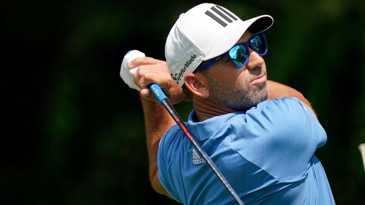 Sergio Garcia hits on the second tee during the first round of the Tour Championship golf tournament. — AP