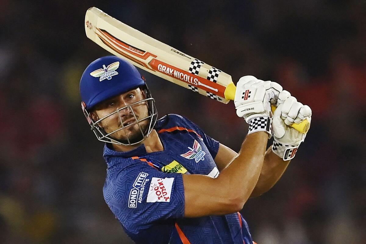 Lucknow Super Giants' Marcus Stoinis plays a shot against Punjab Kings. — AFP