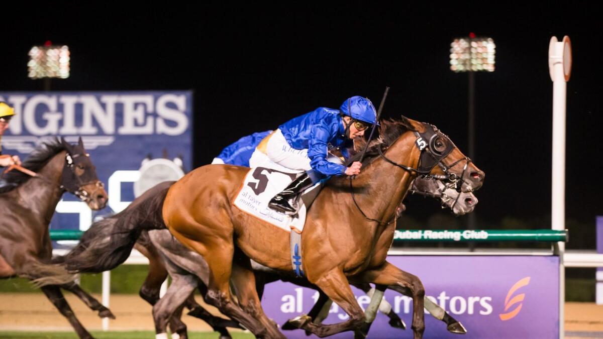 Jockey William Buick guides D'Bai to victory in the Group 2 Zabeel Mile on Thursday night. (Dubai Racing Club)